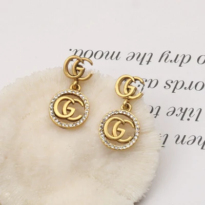 Orecchini a bottone di marca famosa di gioielli di lusso all'ingrosso Gucci′ S Gg Orecchini di design ispirati alle donne Orecchini a cerchio di marca popolare